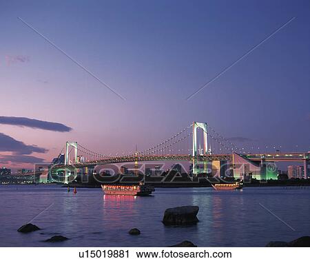 Stock Image - Rainbow Bridge at sunset, Tokyo, Japan. Fotosearch
