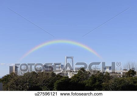 Stock Image - Rainbow Bridge from Odaiba Seaside Park Station, Odaiba, Minato-ku, Tokyo, Japan. Fotosearch