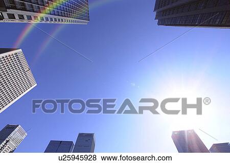 Stock Photo - Rainbow over Marunouchi building group, Marunouchi, Chiyoda-ku, Tokyo, Japan. Fotosearch