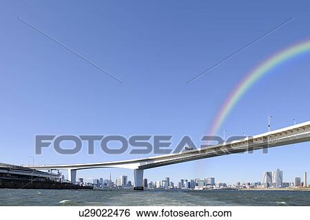 Stock Photograph - Rainbow over Tokyo skyline, Japan. Fotosearch