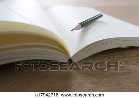 Stock Photograph - Recycled paper notebook and a pencil. Fotosearch
