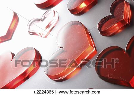 Stock Image - Red heart candies. Fotosearch