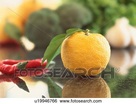 Red peppers and a Yuzu fruit on a kitchen counter View Large Photo Image Stock Photograph - Red peppers and a Yuzu fruit on a kitchen counter. Fotosearch