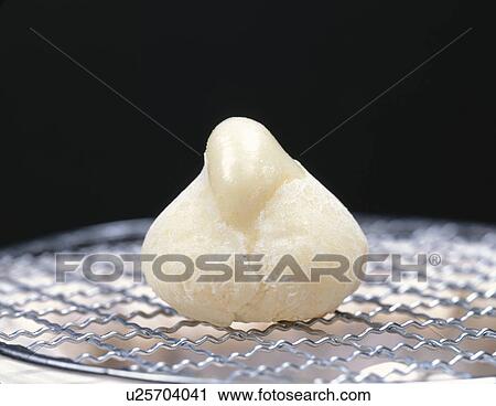 Stock Image - Rice cake on a brazier. Fotosearch