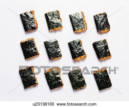 Rice crackers covered in seaweed View Large Photo Image Stock Image - Rice crackers covered in seaweed. Fotosearch