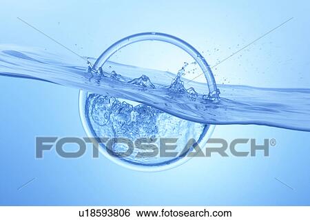 Ring dropped in water, blue background View Large Photo Image Stock Photograph - Ring dropped in water, blue background. Fotosearch