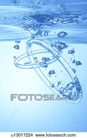 Rings dropped in water, blue background View Large Photo Image Picture - Rings dropped in water, blue background. Fotosearch