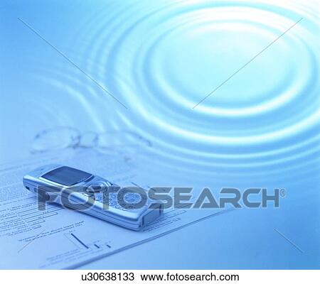 Stock Image - Ripple over mobile phone and glasses. Fotosearch