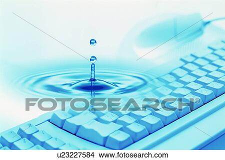 Picture - Rippled water over keyboard. Fotosearch