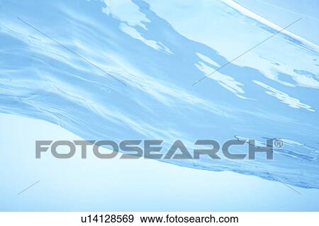Rippled water surface, close up, blue background View Large Photo Image Stock Photo - Rippled water surface, close up, blue background. Fotosearch