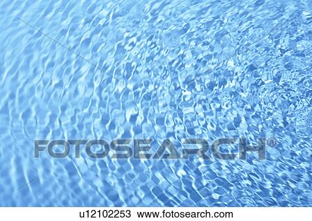 Stock Image - Rippled water surface, full frame. Fotosearch