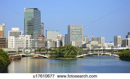 Stock Photo - River, bridge and skyscrapers, Osaka, Japan. Fotosearch
