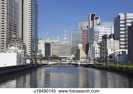 Stock Photography - River lined with skyscrapers. Nakanoshima, Nishi-ku, Osaka, Japan. Fotosearch