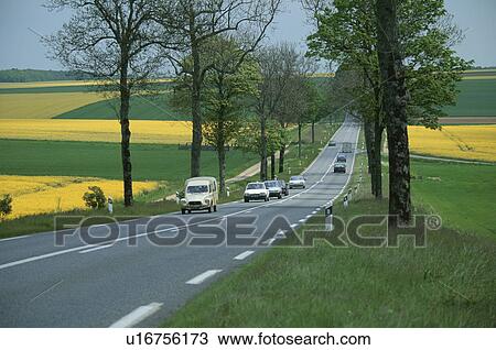 Stock Image - Road through the Champagne countryside, France. Fotosearch