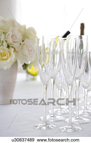 Stock Photo - Roses and champagne flutes. Fotosearch