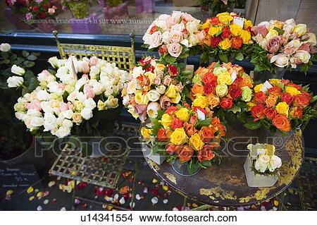 Picture - Roses in front of a flower shop, Paris, France. Fotosearch