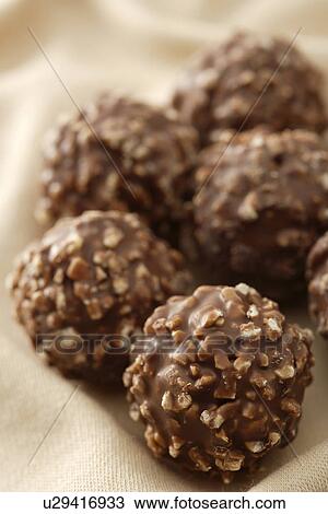 Stock Image - Rough round chocolates. Fotosearch