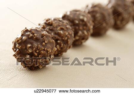 Rough round chocolates View Large Photo Image Stock Photo - Rough round chocolates. Fotosearch