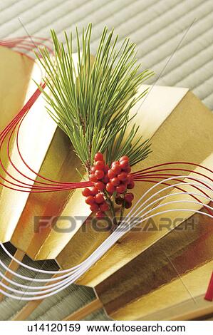 Stock Photo - Sacandra glabra on a fan with mizuhiki cord. Fotosearch