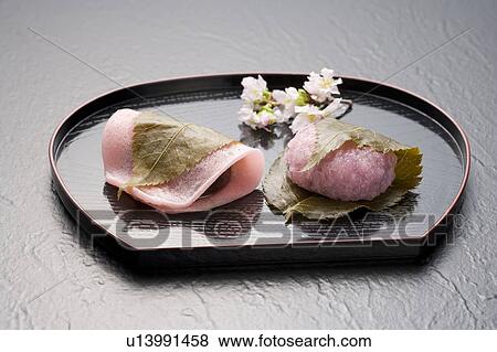 Sakuramochi on a tray with cherry blossom branch View Large Photo Image Stock Photo - Sakuramochi on a tray with cherry blossom branch. Fotosearch