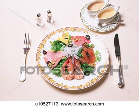 Stock Image - Salad with ham, shrimp and olives. Fotosearch