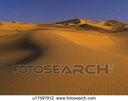 Sand dunes in desert View Large Photo Image Stock Image - Sand dunes in desert. Fotosearch