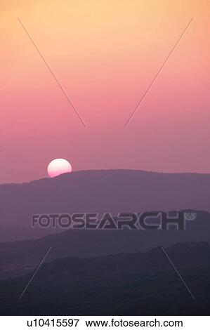 Stock Photo - Setting sun over landscape, Jogakura-ohashi, Aomori Prefecture, Japan. Fotosearch