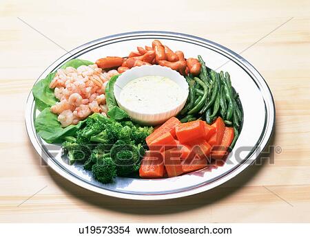 Picture - Shrimp, vegetables and mini sausages with dip. Fotosearch