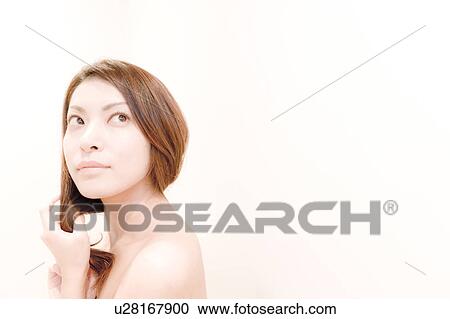 Side View of Young Woman, Holding Her Hair View Large Photo Image Stock Image - Side View of Young Woman, Holding Her Hair. Fotosearch