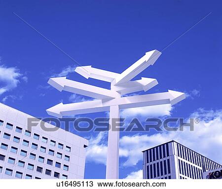 Sign in a city with arrows pointing in different directions View Large Photo Image Stock Image - Sign in a city with arrows pointing in different directions. Fotosearch