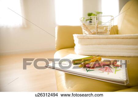 Picture - Sketch pad on a sofa. Fotosearch