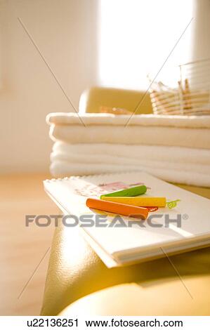Stock Image - Sketch pad on a sofa. Fotosearch