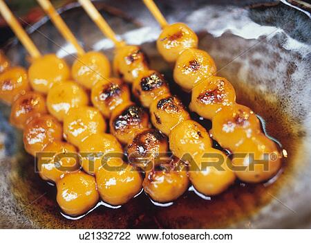Skewered dumplings with brown sauce View Large Photo Image Stock Image - Skewered dumplings with brown sauce. Fotosearch