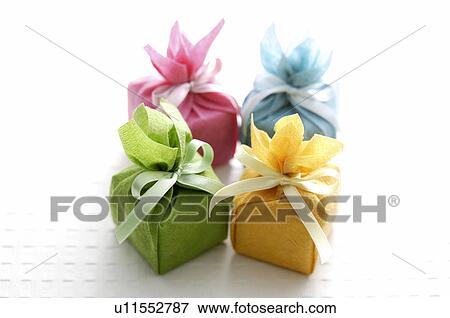 Small gift boxes wrapped in tissue paper View Large Photo Image Stock Photo - Small gift boxes wrapped in tissue paper. Fotosearch