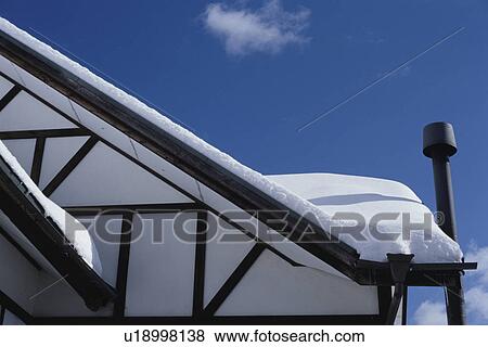 Stock Photo - Snow collected on house roof. Mt Yatsugatake, Yamanashi Prefecture, Japan. Fotosearch