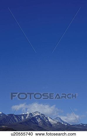 Stock Image - Snow-covered mountain range. Mt Yatsugatake, Yamanashi Prefecture, Japan. Fotosearch