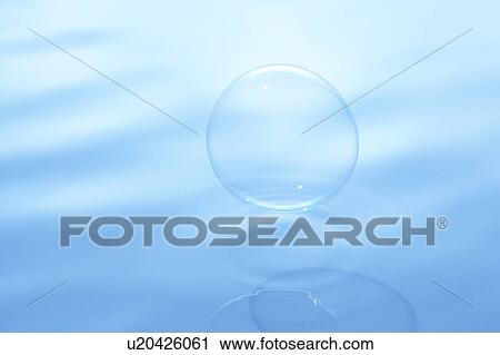 Soap bubble on water surface, blue background View Large Photo Image Stock Image - Soap bubble on water surface, blue background. Fotosearch
