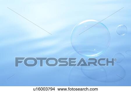 Soap bubbles on water surface, blue background, copy space View Large Photo Image Picture - Soap bubbles on water surface, blue background, copy space. Fotosearch