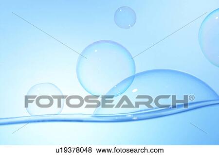 Soap bubbles on water surface, blue background View Large Photo Image Stock Photo - Soap bubbles on water surface, blue background. Fotosearch