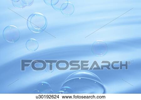 Soap bubbles over water surface, blue background View Large Photo Image Picture - Soap bubbles over water surface, blue background. Fotosearch