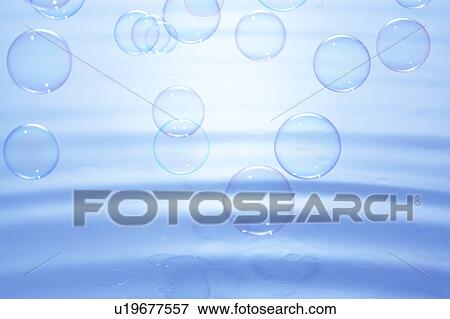 Soap bubbles over water surface, blue background View Large Photo Image Stock Photo - Soap bubbles over water surface, blue background. Fotosearch