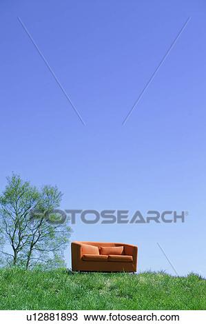 Stock Image - Sofa on grassy hill, Sugadaira Plateau, Nagano Prefecture, Japan. Fotosearch