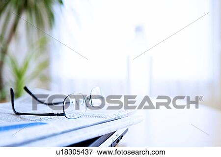 Spectacles on a newspaper View Large Photo Image Stock Photo - Spectacles on a newspaper. Fotosearch