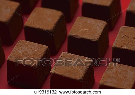 Stock Image - Square chocolate pieces. Fotosearch