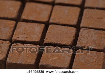 Square chocolate pieces View Large Photo Image Stock Photography - Square chocolate pieces. Fotosearch