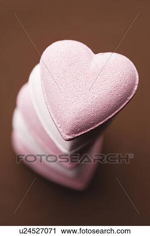 Stock Image - Stack of pink candy hearts. Fotosearch