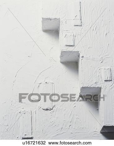 Stock Image - Staircase pattern on textured white wall. Fotosearch