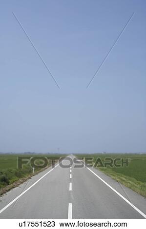 Stock Image - Straight road stretching into distance, Perth, Australia. Fotosearch