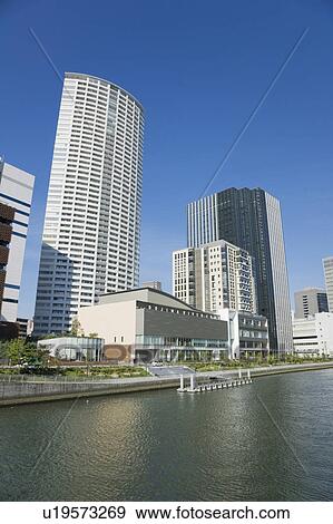 Stock Photo - Street lined with skyscrapers. Nakanoshima, Nishi-ku, Osaka Japan. Fotosearch