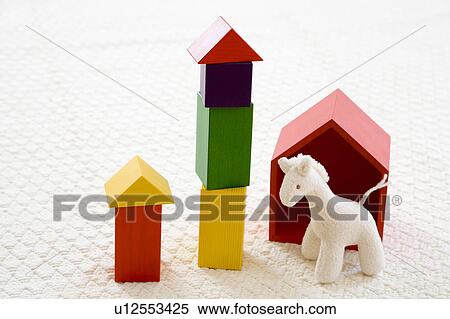 Stock Photography - Stuffed giraffe and building blocks. Fotosearch